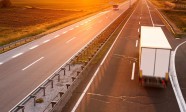 30573509 - truck and bus on highway in motion blur at sunset