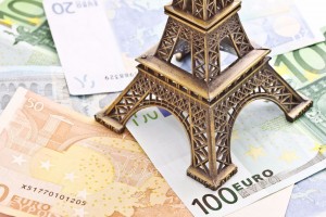 14877549 - eiffel tower model with euro banknotes