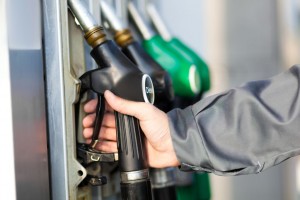 Man holding a fuel nozzle