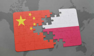 puzzle with the national flag of china and poland on a world map background.