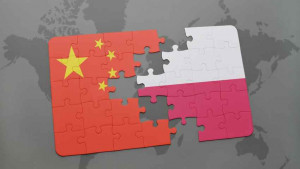 puzzle with the national flag of china and poland on a world map background.